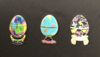Three egg pin set representing each tournament regions.