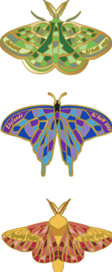 A set of green, purple, and red moth pins.