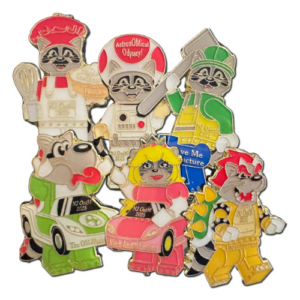 Six different versions of OMER the raccoon dressed in block style characters that represent the five Odyssey problems and spontaneous for 2025.