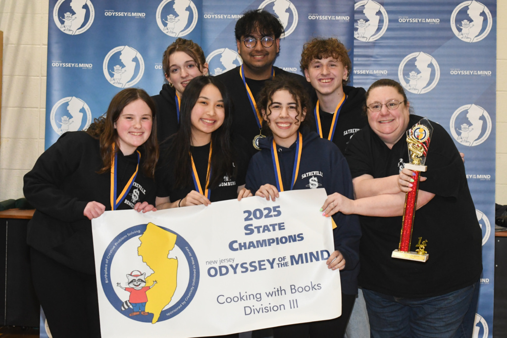 Sayreville War Memorial HS Division 3 team with their first place championship trophy and banner. 