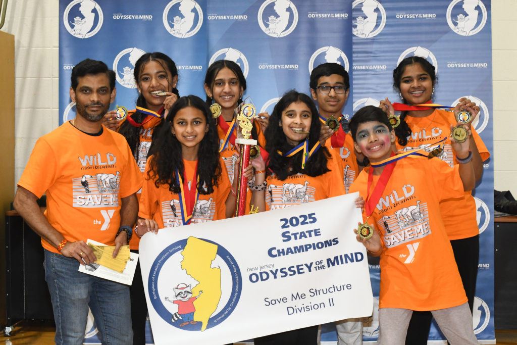 Edison YMCA Division 2 team with their first place championship trophy and banner. 