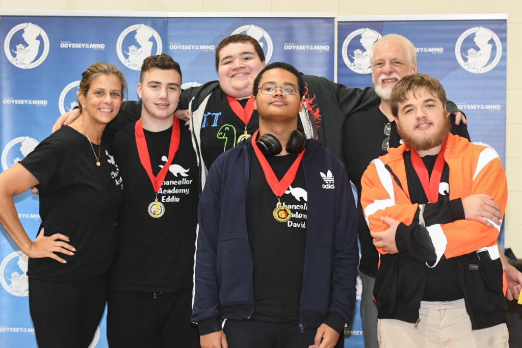 Chancellor Academy Division 3 team wearing their red ribbon Ranata Fusca medals.