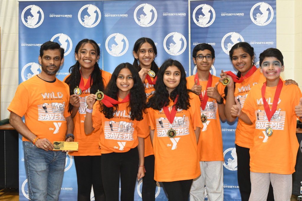 Edison YMCA Division 2 team in orange team t-shirts wearing the red ribbon Ranata Fusca medals.