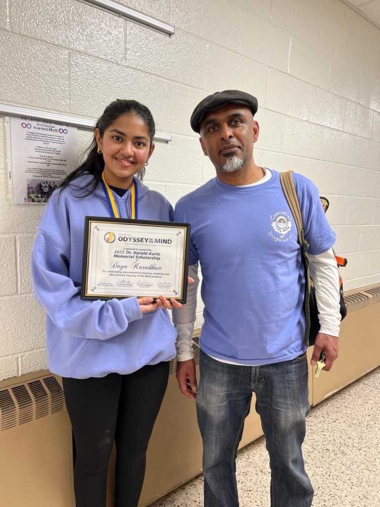Scholarship winner, Daya Karakkatt, posing with her coach and award letter. 